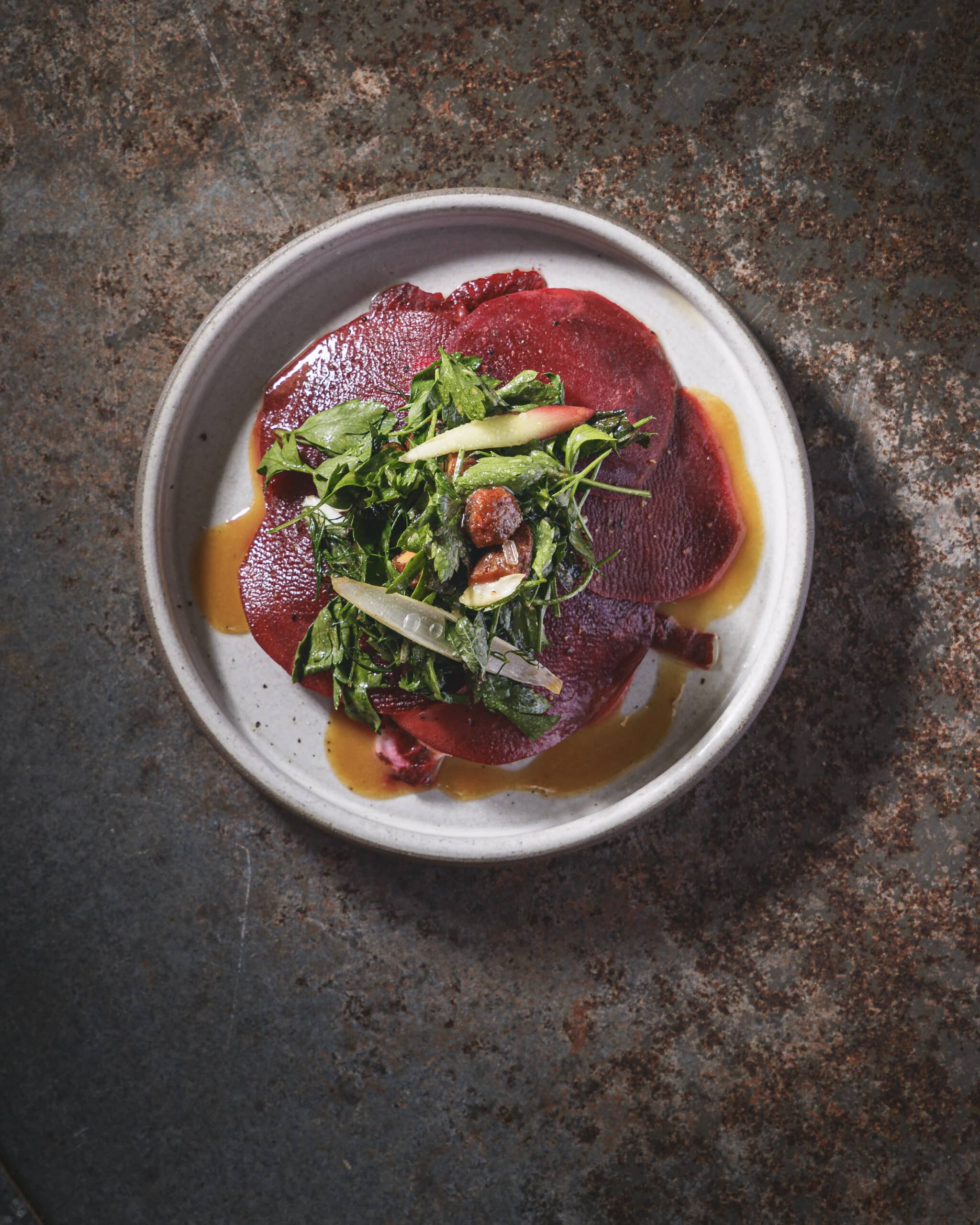 Beetroot salad with fresh herbs and pickled vegetables served at Ara Restaurant near Spitalfields.