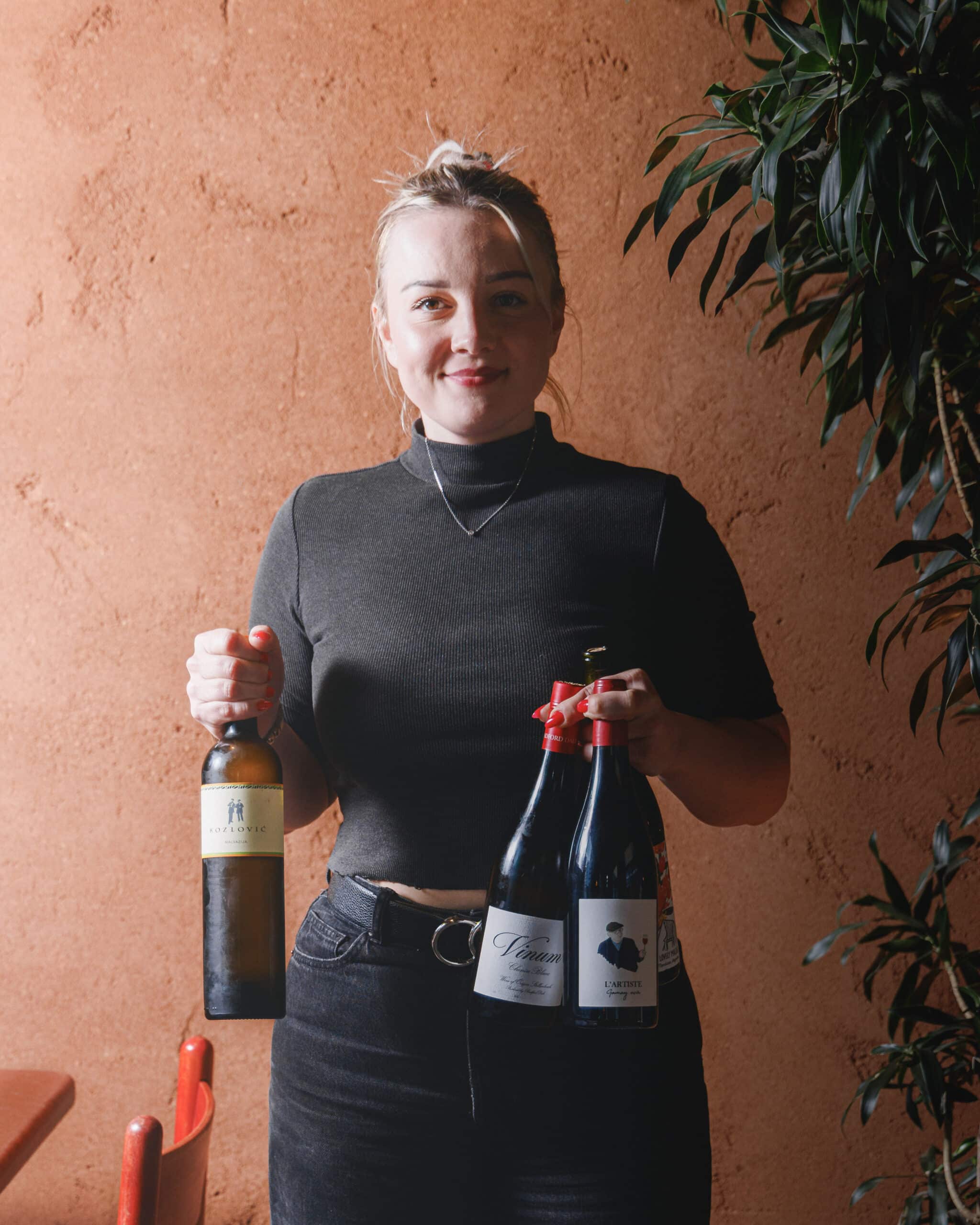 Team member at Ara Restaurant in Aldgate East presenting a selection of organic, biodynamic and low-intervention wines from sustainable producers.